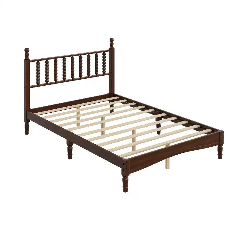 Cama de plataforma retro de madera con cabecera en forma de calabaza